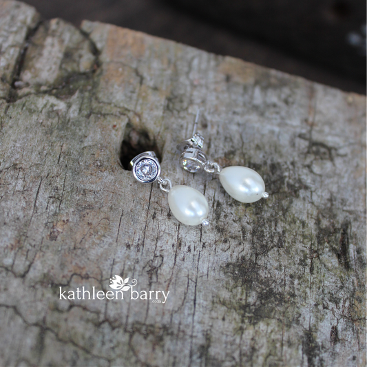 Simple pearl drop cubic zirconia stud earrings available in Silver finish only