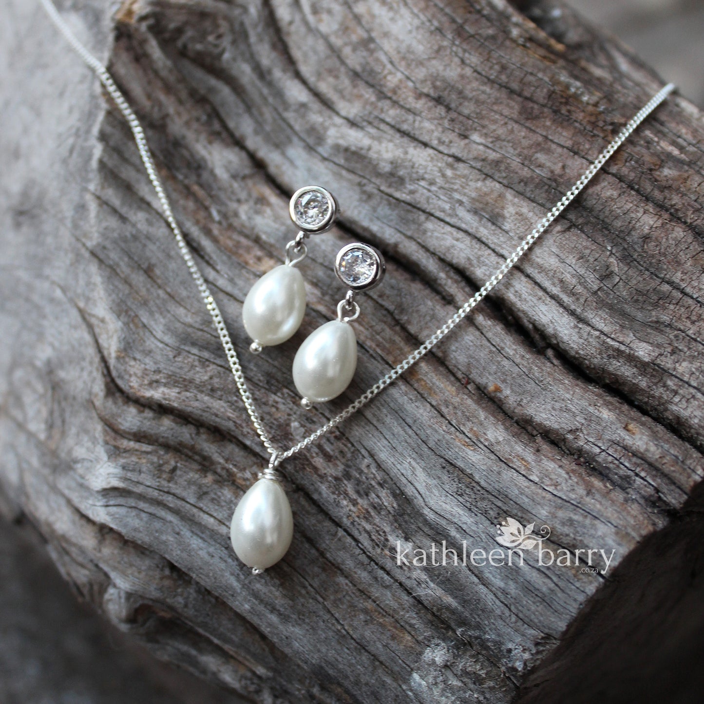 Simple pearl drop cubic zirconia stud earrings available in Silver finish only
