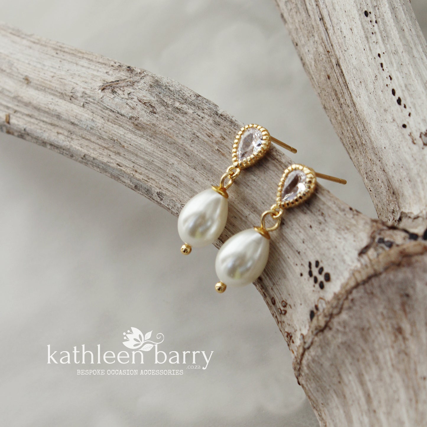Dainty pearl drop cubic zirconia stud earrings available in Gold finish only (limited stock available)