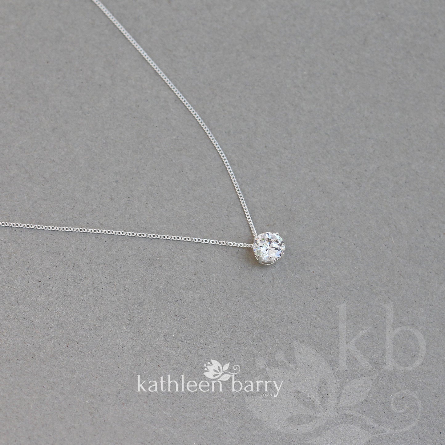 Cubic zirconia single floating gem pendent on a sterling silver chain - two length options