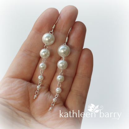 Pearl drop earrings grading in size from big to small cascading pearls