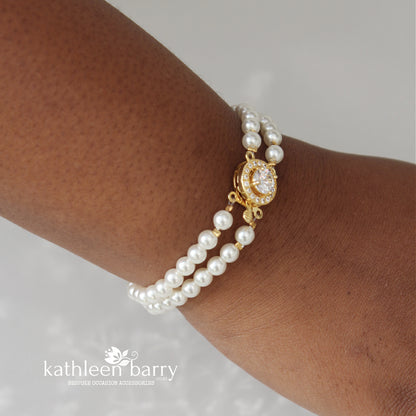 Ilke double strand pearl barecelet available in gold or rose gold 3 pearl color options