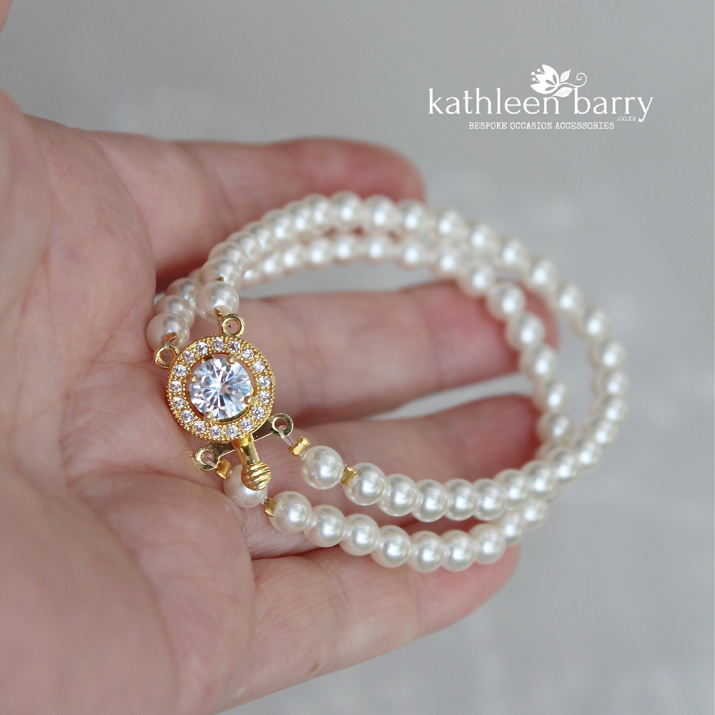 Ilke double strand pearl barecelet available in gold or rose gold 3 pearl color options